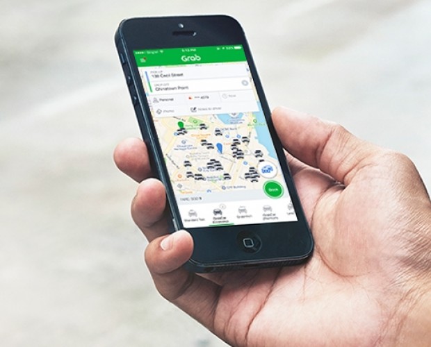 Toyota invests in Uber rival Grab, agrees data collaboration