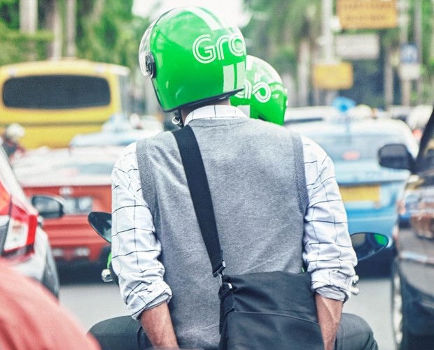 Asian taxi app Grab acquires payments firm Kudo as part of $700m investment in Indonesia